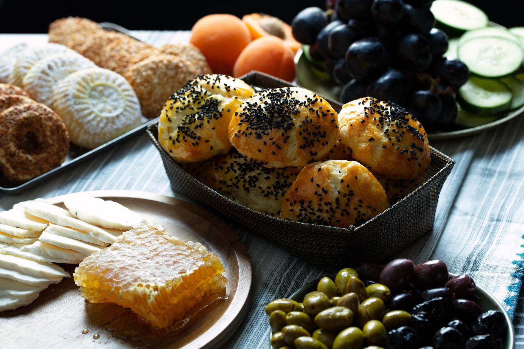 A typical Turkish breakfast spread includes a bevy of cheese, olives, local honey, fruits and baked goods like pogaca and gazleme.